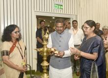 Shri Dharmendra Pradhan lighting the lamp at the launched “Guidelines for Co-location of Anganwadi Centres with Schools
