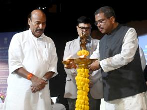 lighting the lamp at the signing of tripartite MoU
