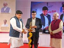 Dr. Sukanta Majumdar lighting the lamp at the Bharatiya Bhasha Utsav celebrations