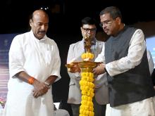 lighting the lamp at the signing of tripartite MoU
