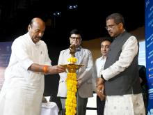 Dr. Virendra Kumar lighting the lamp at the signing of tripartite MoU between DEPwD