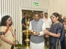 Shri Dharmendra Pradhan lighting the lamp at the launched “Guidelines for Co-location of Anganwadi Centres with Schools