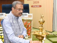 Shri Dharmendra Pradhan lighting the lamp at the launch of School Management Committee (SMC) Guidelines 2026