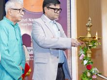Shri Sanjay Kumar lighting the lamp at the launch of Bharatiya Bhasha Summer Camp 2026